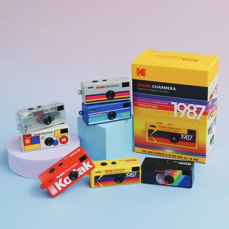 Kodak Charmera toy camera set with colorful packaging on a light blue background
